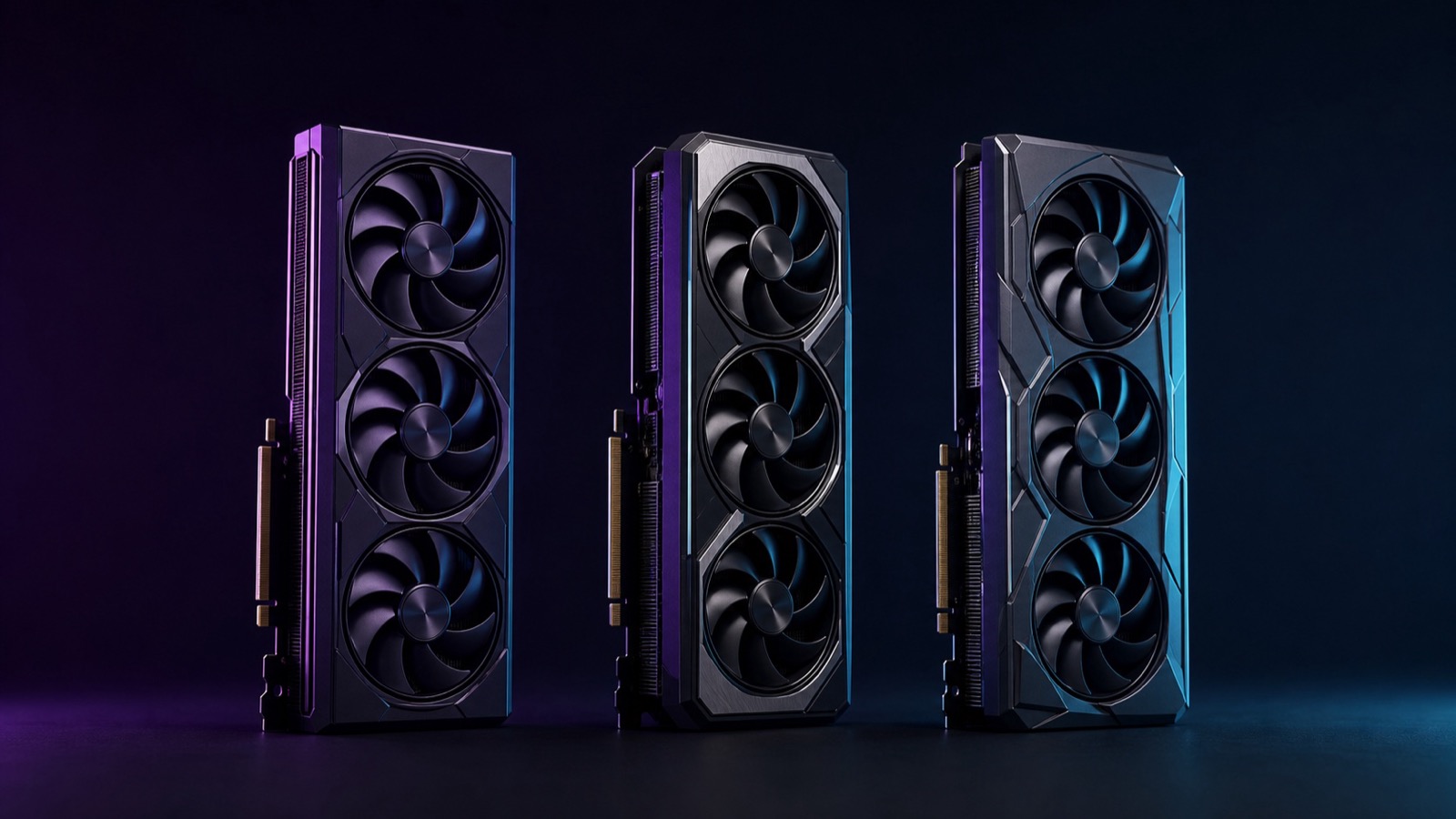 Three modern graphics cards lined up side by side in a dark studio, fans facing forward