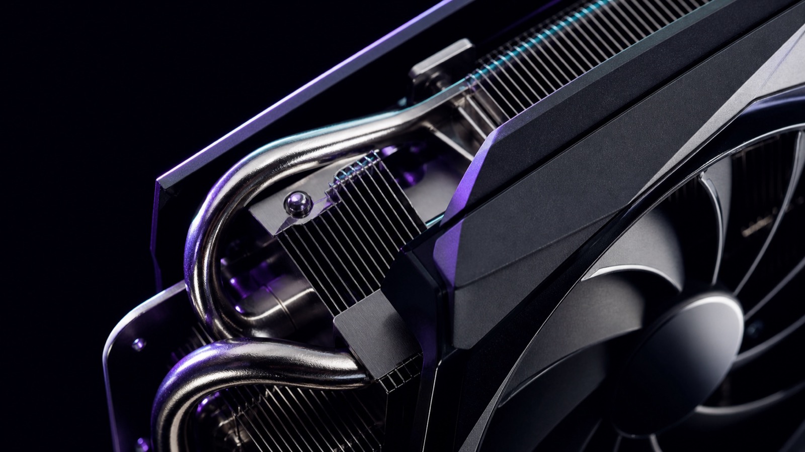 Close-up of a graphics card cooler with subtle LED lighting, the card installed in a test bench PC